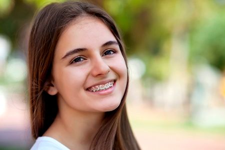 smiling teen girl with braces